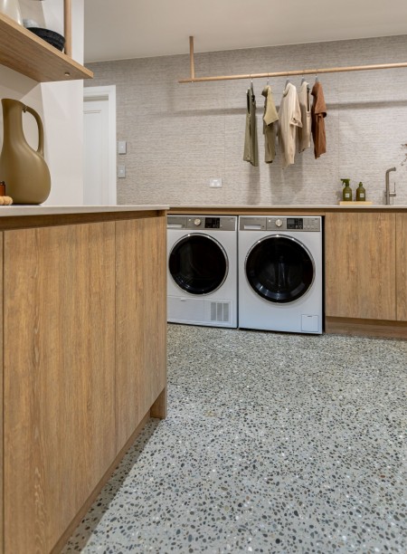 basement laundry with integrated laundry hampers hidden 2
