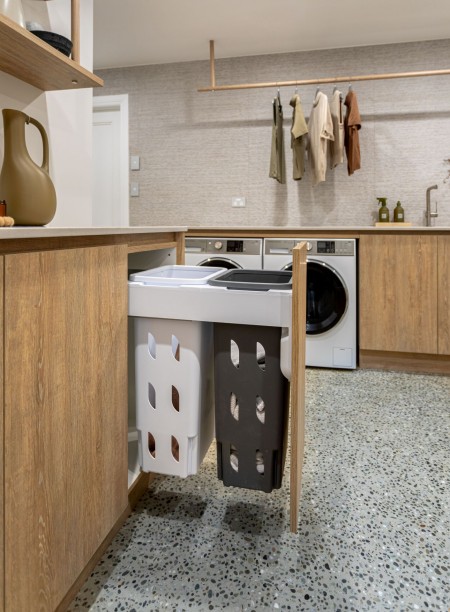 basement laundry with integrated laundry hampers in view 2