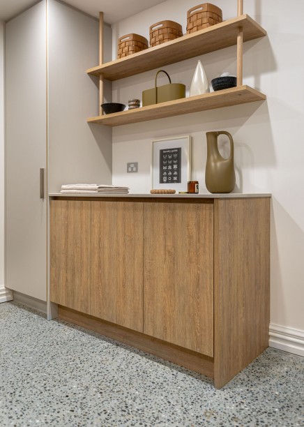 basement laundry with integrated laundry hampers hidden 1